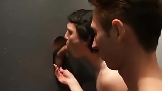 Young boys working a glory hole.