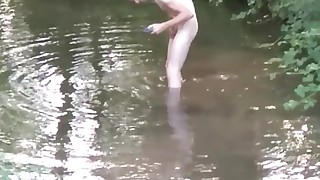 Public twink waching in river naked